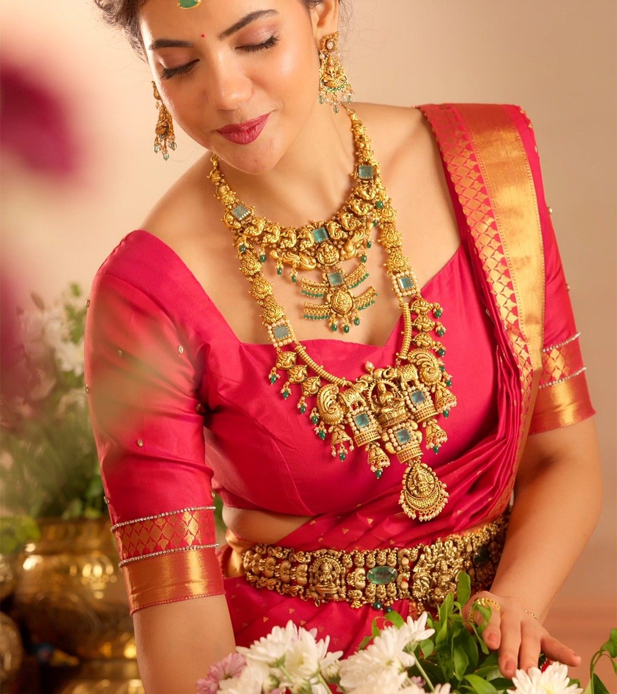 Bride wearing a temple haram, necklace and oddiyanam in gold-plated 925 silver - Vilva Jewels Coimbatore